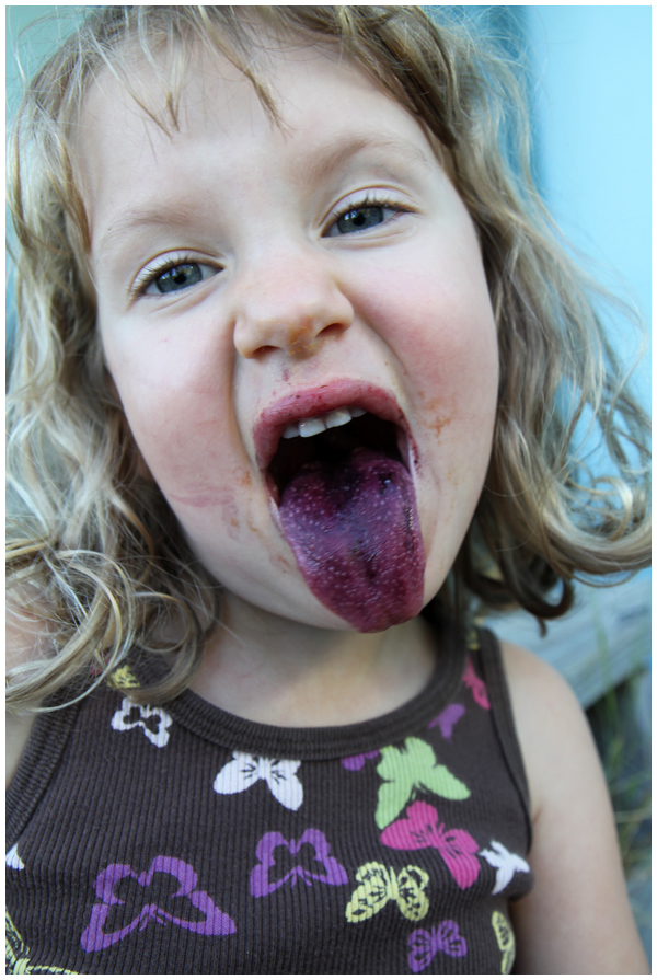 Purple tongue from eating so many blackberries