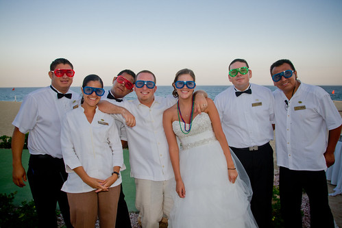 bride and groom fun picture with staff all wearing shutter shades