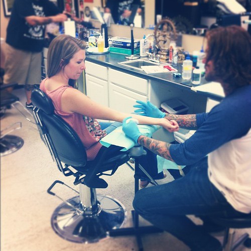 What has 2 thumbs and just got her first tattoo? --> this girl <--