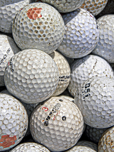 Golf balls at a market (CC) by Kaptain Kobold on Flickr.