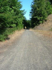 Kevin rides towards the landslide on the CZ haul road