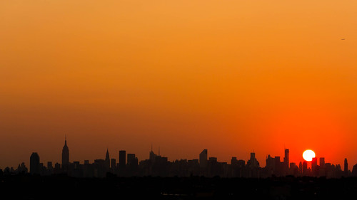 Sun Setting over the Manhattan Skyline, as seen from Flushing, Queens.