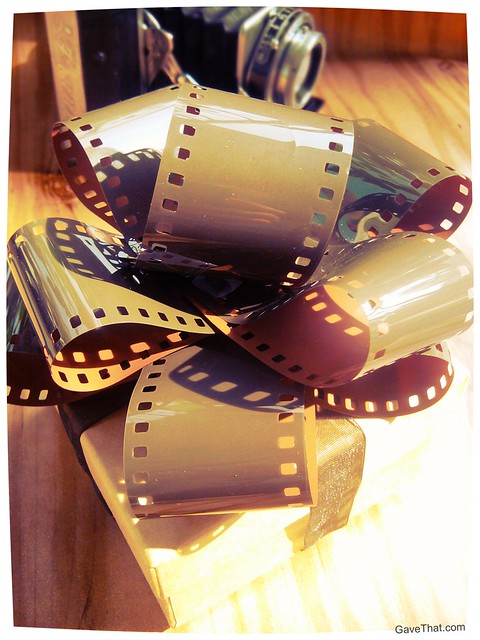 Finished DIY Camera Film Gift Bows on a present by gift wrap blog Gave That