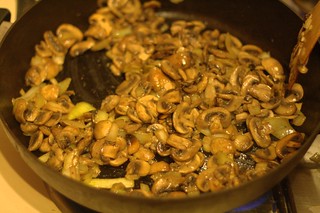 Photo of mushrooms and onions in a frying pan
