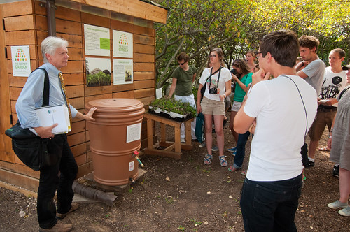 USDA National Landscape Architect, Natural Resources Conservation Service Bob Snieckus (left), demonstrates the construction and operation of a rain barrel attached to a sustainably built shed that has a green roof to French students from Ecole Du Breuil, School of Horticulture and Landscaping , Paris, France. 