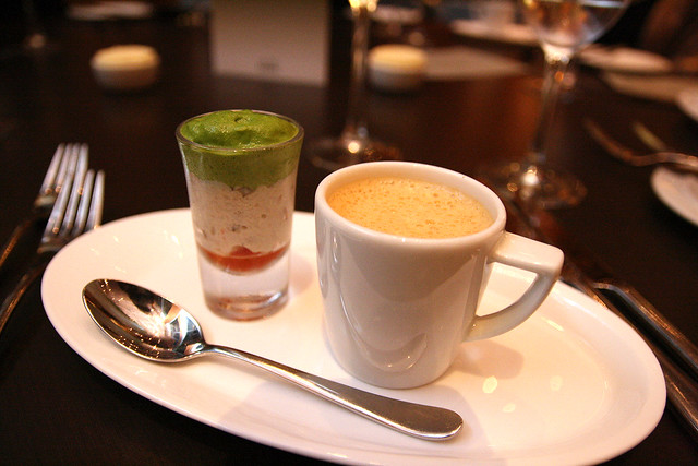 Amuse bouche of lobster bisque with fennel, crab salad