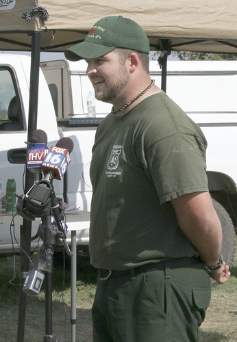 Forest Service employee Bradley Taylor, an emergency medical technician and search and rescue technician on the Ozark-St. Francis National Forest, speaks to reporters Wednesday, Sept. 12, in Stone County, Ark., after finding Landen Trammell playing in a puddle about 30 hours after the toddler disappeared. Photo credit: Courtesy of Lori Freeze, Stone County Leader