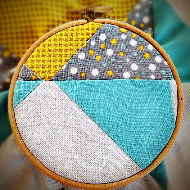 Tonight's football practice craft: embroidering a little somethin' on my first-ever quilt block. #quilting #embroidery I like how the piecing ends up looking in the small hoop!