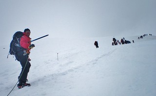 Kevin Points Towards Summit of Mt Rainier