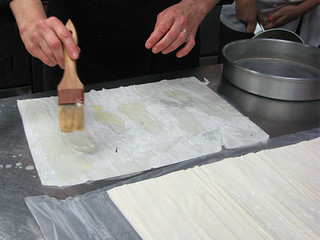buttering filo dough at New School of Cooking