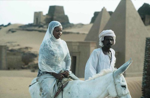 Sudanese ride through the ancient pyramids at Meroe in the Republic of Sudan. The Sudan pyramids have been there for thousands of years. by Pan-African News Wire File Photos
