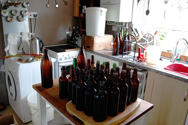 Kitchen with bottles laid out ready for brewing.