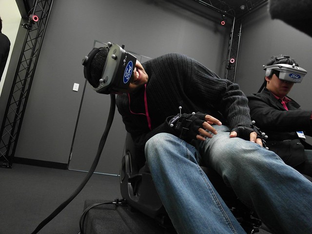 Neerav Bhatt sitting in Ford Australia Virtual Reality 3D Car Simulator, viewing *inside* the car door lock