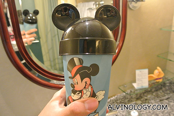 Disney cup with toothbrush and toothpaste inside