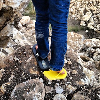 I told her she had to wear shoes to climb the rock mountain at the construction site across the street. She came back with flip flops. Two different ones: yellow from big sister, black from big brother. Oh well. At least she had on somethin'. #flipflops #