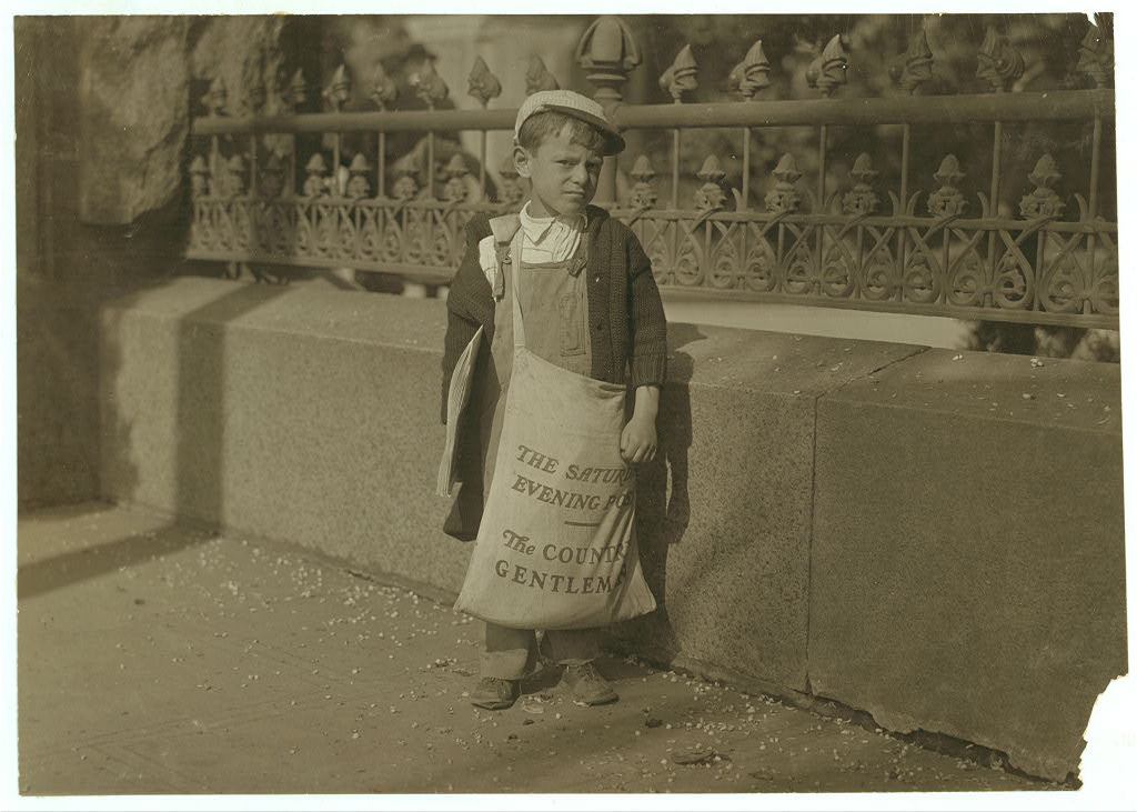Freddie Kafer, a very immature little newsie selling Saturday Evening Posts and newspapers at the entrance to the State Capitol, Sacramento, California