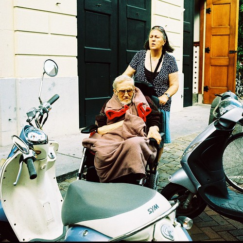 Italian Scene in Leiden. (Sure, why don't you park your Vespa at the church-entrance). by BlacKie-Pix