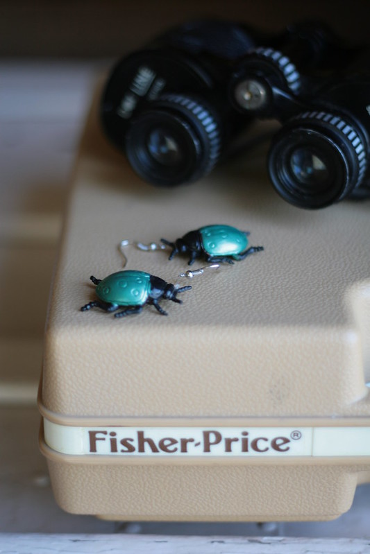 beetle earrings. fisher price record player. binoculars.