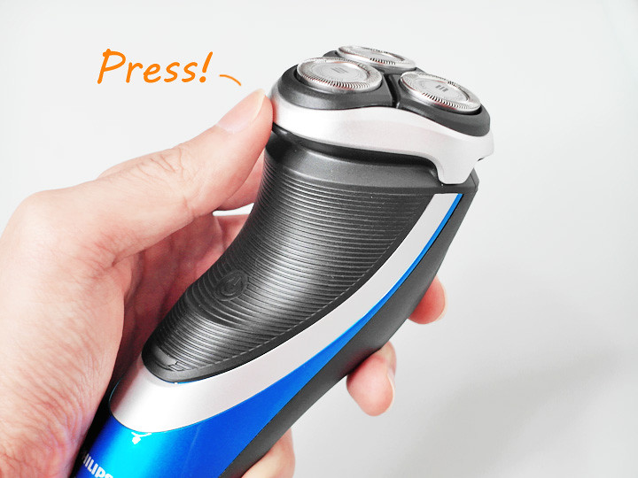 philips aquatouch electric shaver press to open the collection port