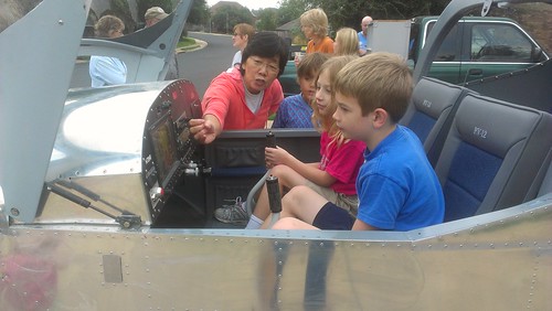 Hakuro Reese showing the kids the airplane Rob built for her by jbellis