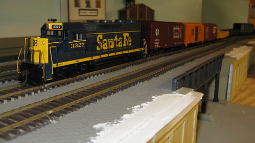 1960's era Santa Fe freight train passing over an urban viaduct. by Eddie from Chicago