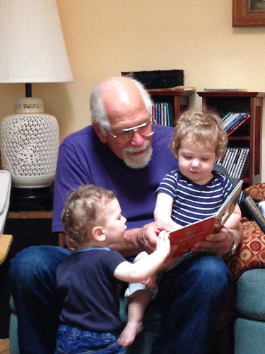Cousins reading with Grandpa