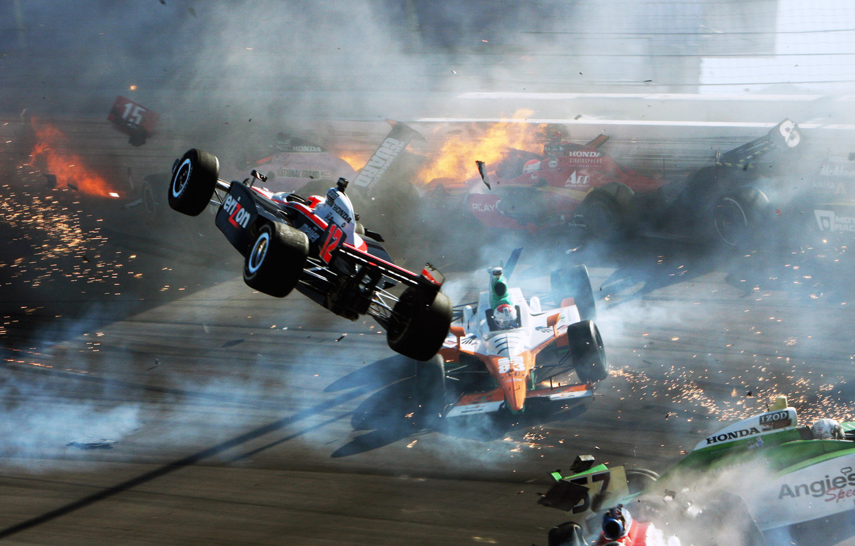 October 16, 2011 - The race car of driver Will Power (left) goes airborne during a multiple-car crash at the IZOD IndyCar World Championship race at the Las Vegas Motor Speedway. Driver Dan Wheldon was killed in the crash. Photo by Barry Ambrose
