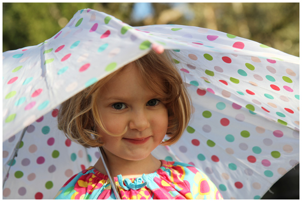 Loving her polka dot umbrella (December 2012)