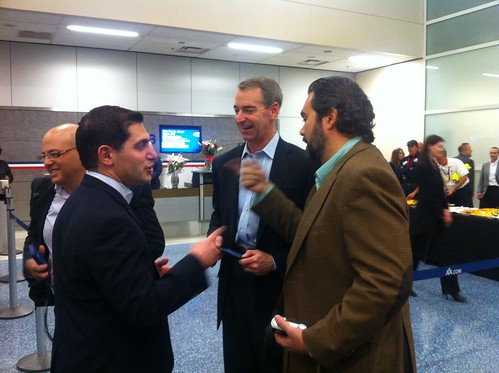 Virasb Vahidi and Tom Horton visiting with American Airlines passengers