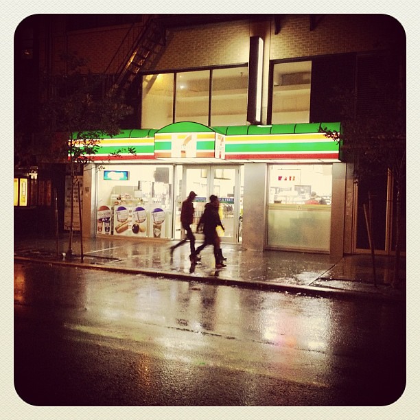 Neither wind gusts nor falling cranes can close the 7 Eleven during NYC Sandy storm