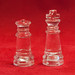 glass chess piece on red