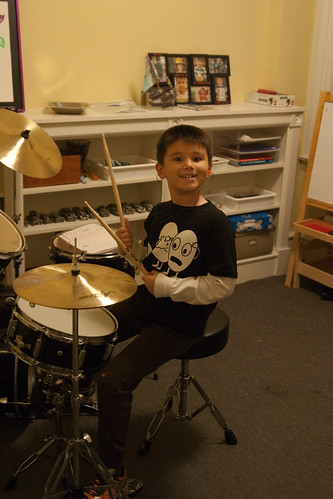 the kid is pleased with his new drums