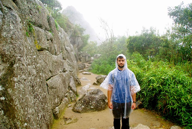 josh in the rain at machu picchu