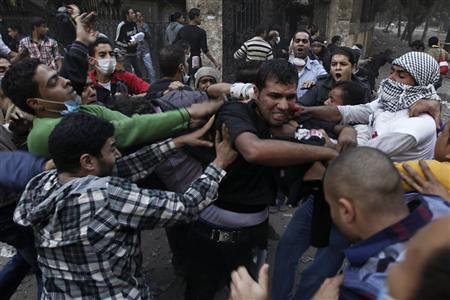 Egyptians clash with security personnel near the US embassy in Cairo. Thousands demonstrated in November 2012 against repression and dictatorship. by Pan-African News Wire File Photos