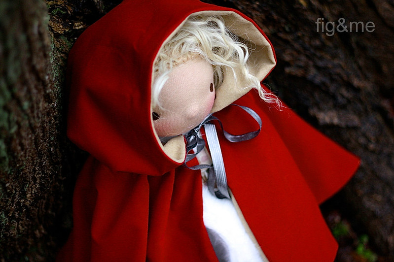 A scarlet red hooded cape