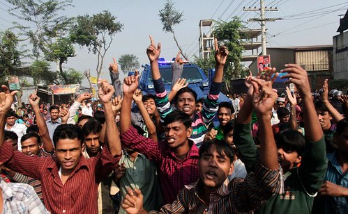 Bangladesh factory workers demonstrate against the conditions that lead to a deadly fire that killed over 100 people. The country is a center of garment production. by Pan-African News Wire File Photos