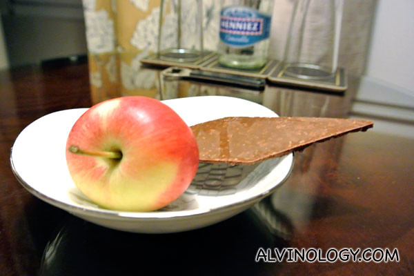 A plate with an apple and a slab of chocolate greeted me upon entrance
