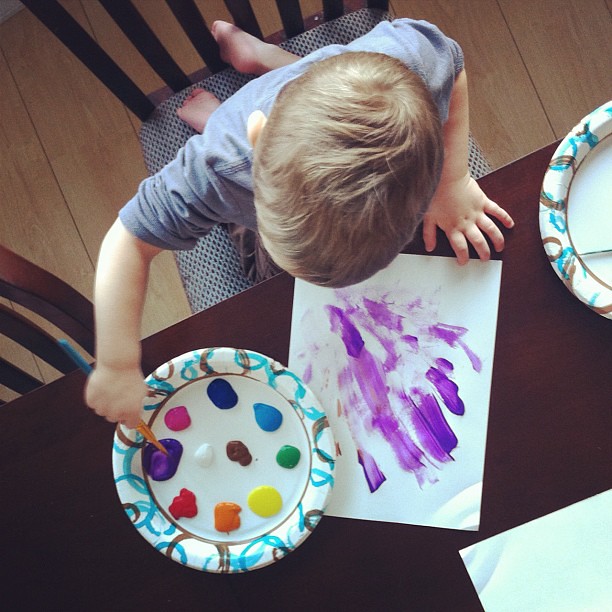 The boy loves to paint