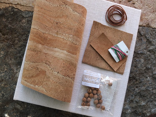 Supplies to make a book cover made of cork fabric
