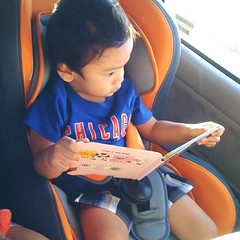 Reading to himself.