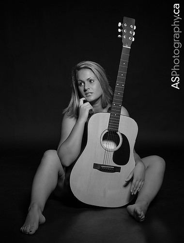Stunning blonde woman with a guitar by andreas_schneider