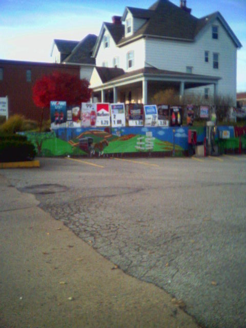 Mural on low wall next to gas station in Perrysville