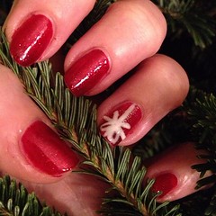 That's a Christmas present with ribbon and a how. NOT an albino spider as Lin thinks. #nailsofinstagram