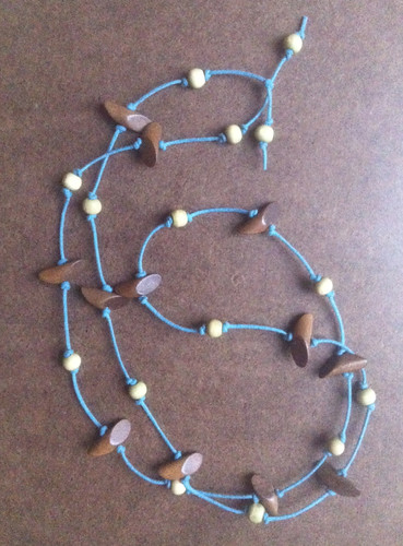 Necklace with Wooden Beads on Knotted Blue Cord by randubnick