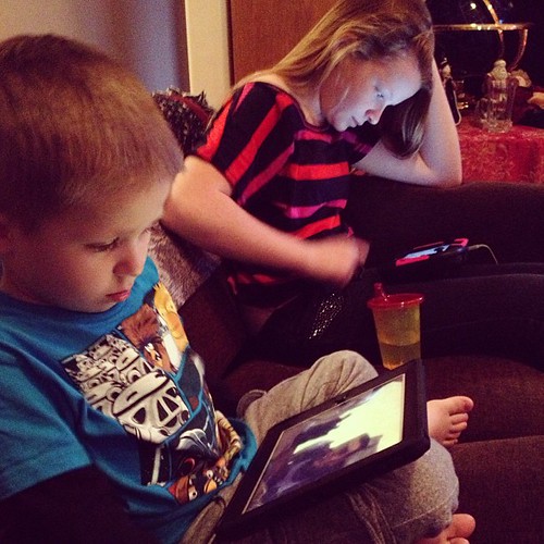 Z & cousin Jessi on their devices.