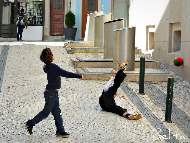 Boys playing on a street in Cascais summer resort
