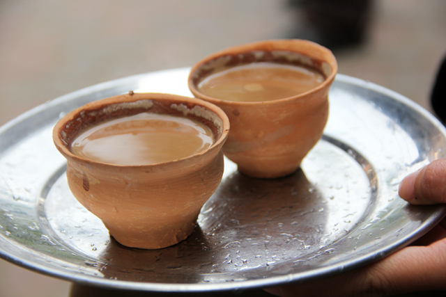 Two freshly poured cups of chai!
