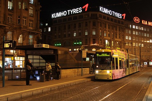 Advert covered Flexity tram arrives at Frankfurt am Main Hauptbahnhof