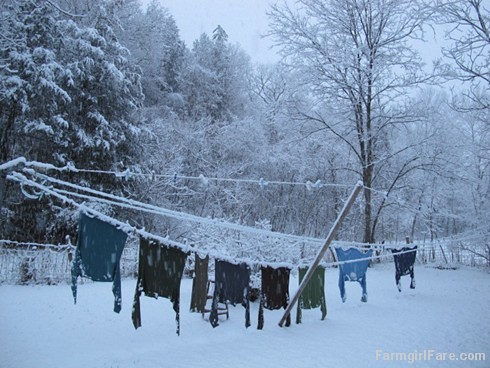 Drying clothes on the line in a snowstorm - FarmgirlFare.com