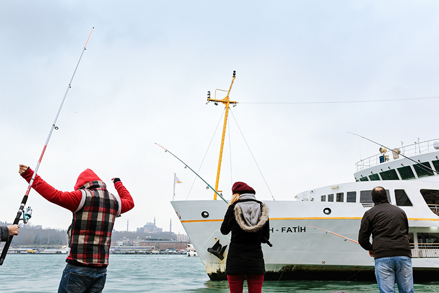 Fishers at Karakoy port on december morning.